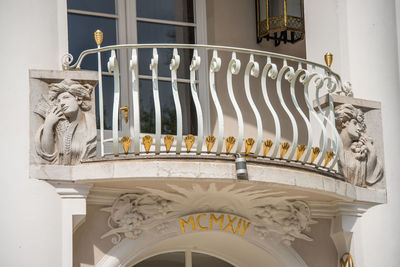 Low angle view of sculpture against building