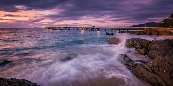 Scenic view of sea against cloudy sky