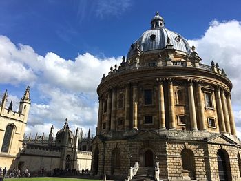 Low angle view of cathedral against cloudy sky