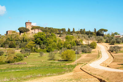 Panoramic view of castle against clear blue sky