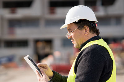 Close-up of man using mobile phone