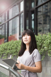 Portrait of a young woman looking at camera