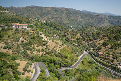 High angle view of road amidst plants and mountains