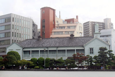 Buildings in city against sky