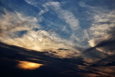 Low angle view of clouds in sky during sunset