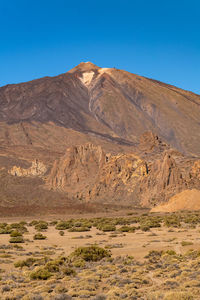 The peak of mountain el teide with the national park beneath it