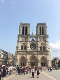 People at notre dame de paris against clear sky