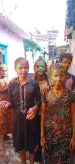 Rear view of people standing outdoors