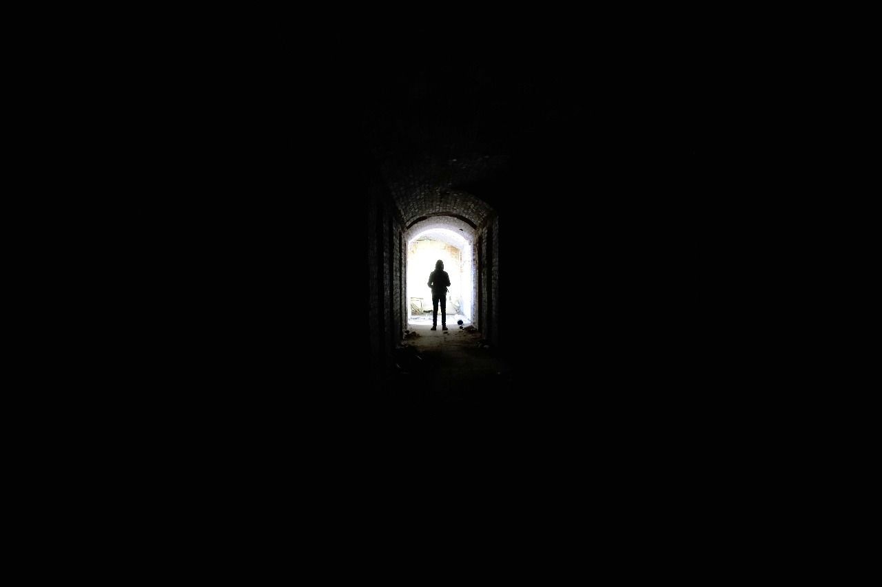 indoors, walking, real people, one person, arch, light at the end of the tunnel, silhouette, lifestyles, day, full length, men, architecture, women, adult, people, adults only