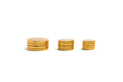 Close-up of coins on white background