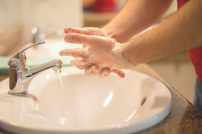 Close-up of woman preparing food at home
