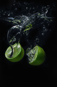 Close-up of water splashing against black background