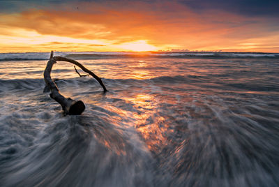 Scenic view of sea against sky during sunset