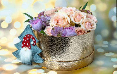 Close-up of roses in basket on table