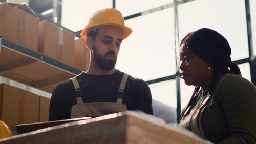 Portrait of young man working in factory