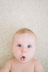 Closeup of baby making funny face at the camera