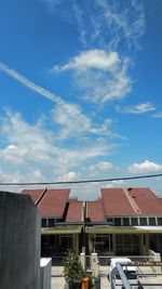 Low angle view of buildings against blue sky
