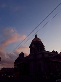 Low angle view of building against sky at sunset