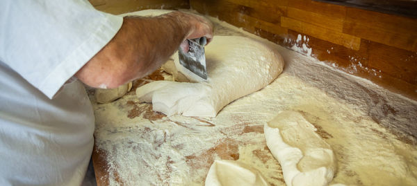 Production of baked bread in a bakery.