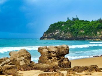 Scenic view of sea against blue sky