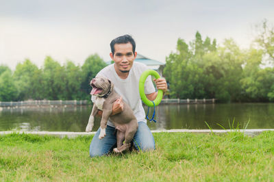 Portrait of smiling young man in lake