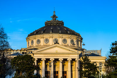 Low angle view of church against clear blue sky