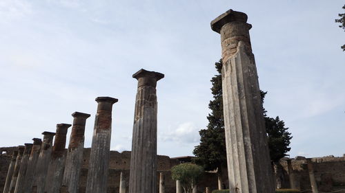 Low angle view of old ruins against sky