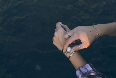 Close-up of woman hand against blurred background