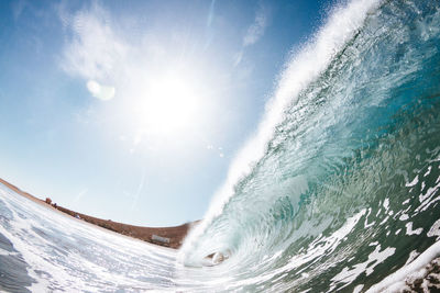 View of wave in sea against sky