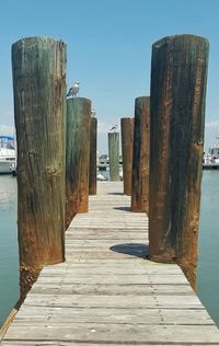 Pier over sea against clear sky