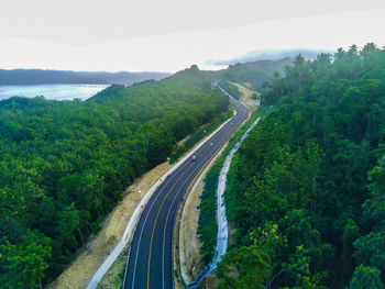 High angle view of road amidst mountains against sky