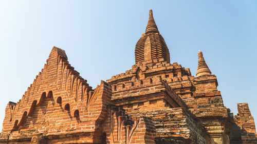 Low angle view of temple building against clear sky