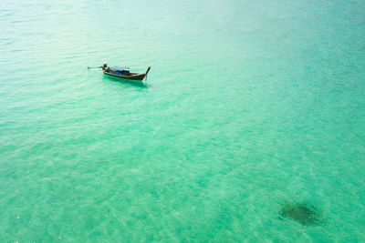 High angle view of boat sailing in sea