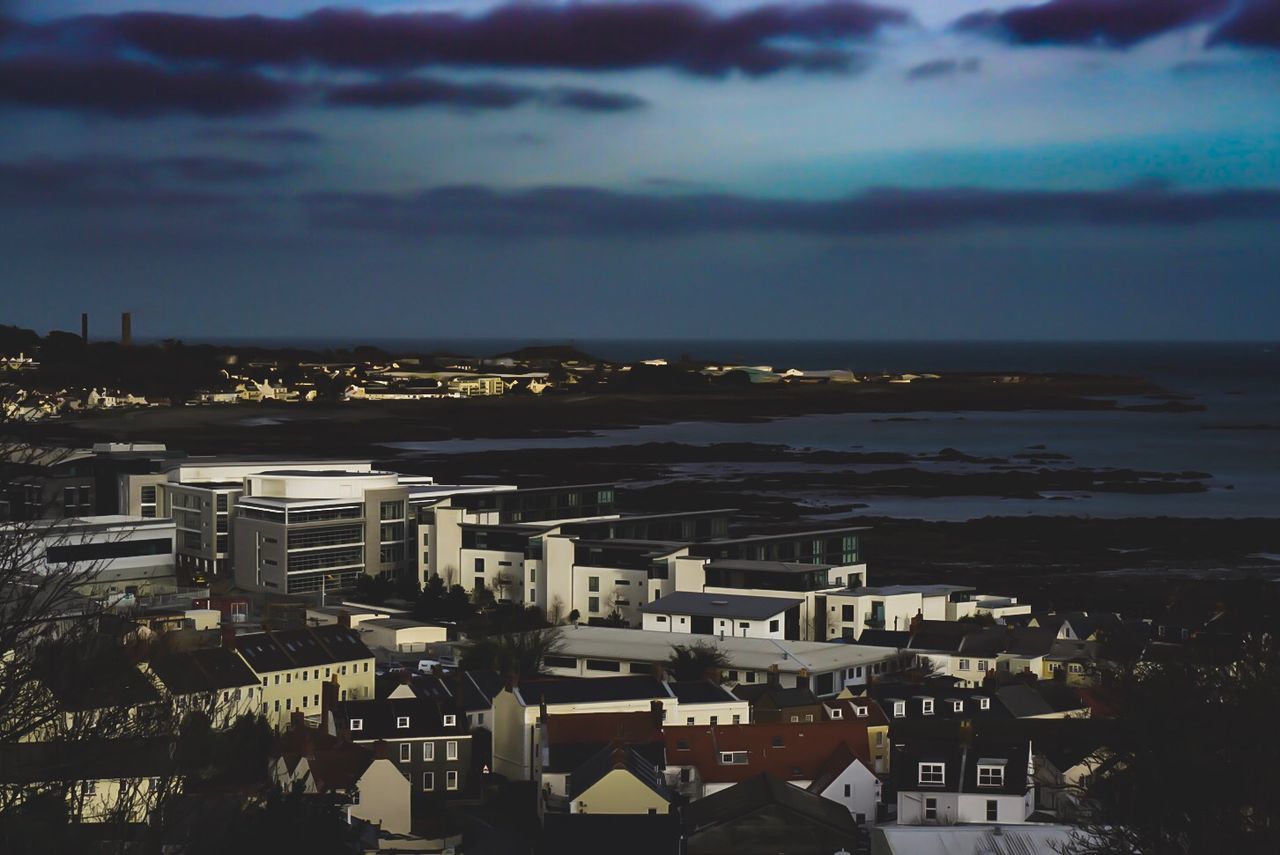 AERIAL VIEW OF CITY AND SEA AGAINST SKY