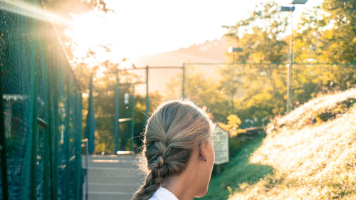 Close-up of boy against trees