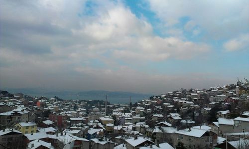 Aerial view of town against sky