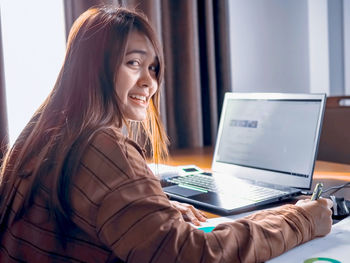 Young woman using mobile phone