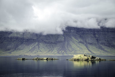 Scenic view of sea against cloudy sky