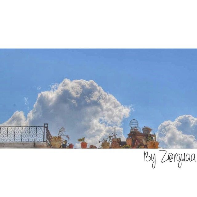 built structure, architecture, sky, building exterior, transfer print, auto post production filter, low angle view, cloud - sky, day, cloud, outdoors, blue, copy space, no people, nature, cloudy, text, roof, railing, building