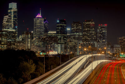 High angle view of light trails on road at night