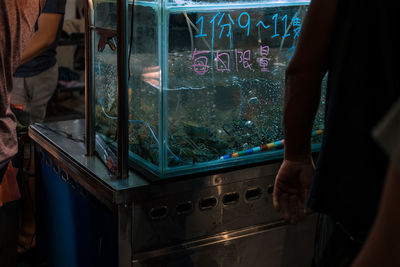 Reflection of man on glass window