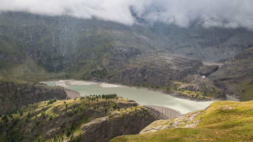 High angle view of lake amidst majestic mountains