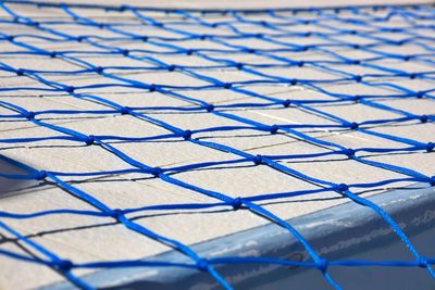 Blue net on floor tiles