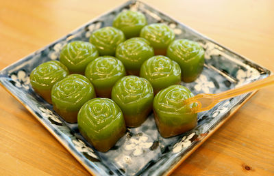 Rose shaped khanom chan, thai ancient dessert made of flour with pandan juice and coconut milk
