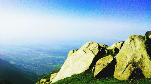 Scenic view of mountains against clear blue sky