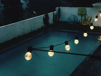 High angle view of illuminated light bulbs on table