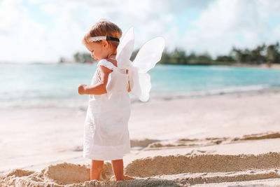 Boy standing on beach