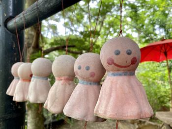 Close-up of stuffed toy hanging on tree