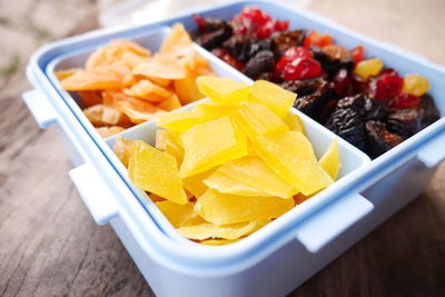 Multi colored sweet candies in plastic container