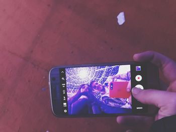 High angle view of man using mobile phone